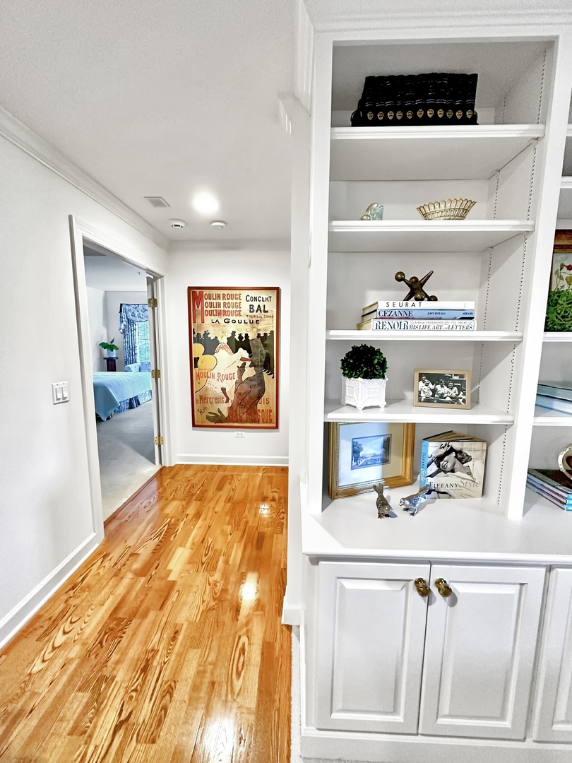 223 Regent Wood Road Northfield, IL 60093 - Photo 9 of 21 a view of kitchen cabinets with wooden floor
