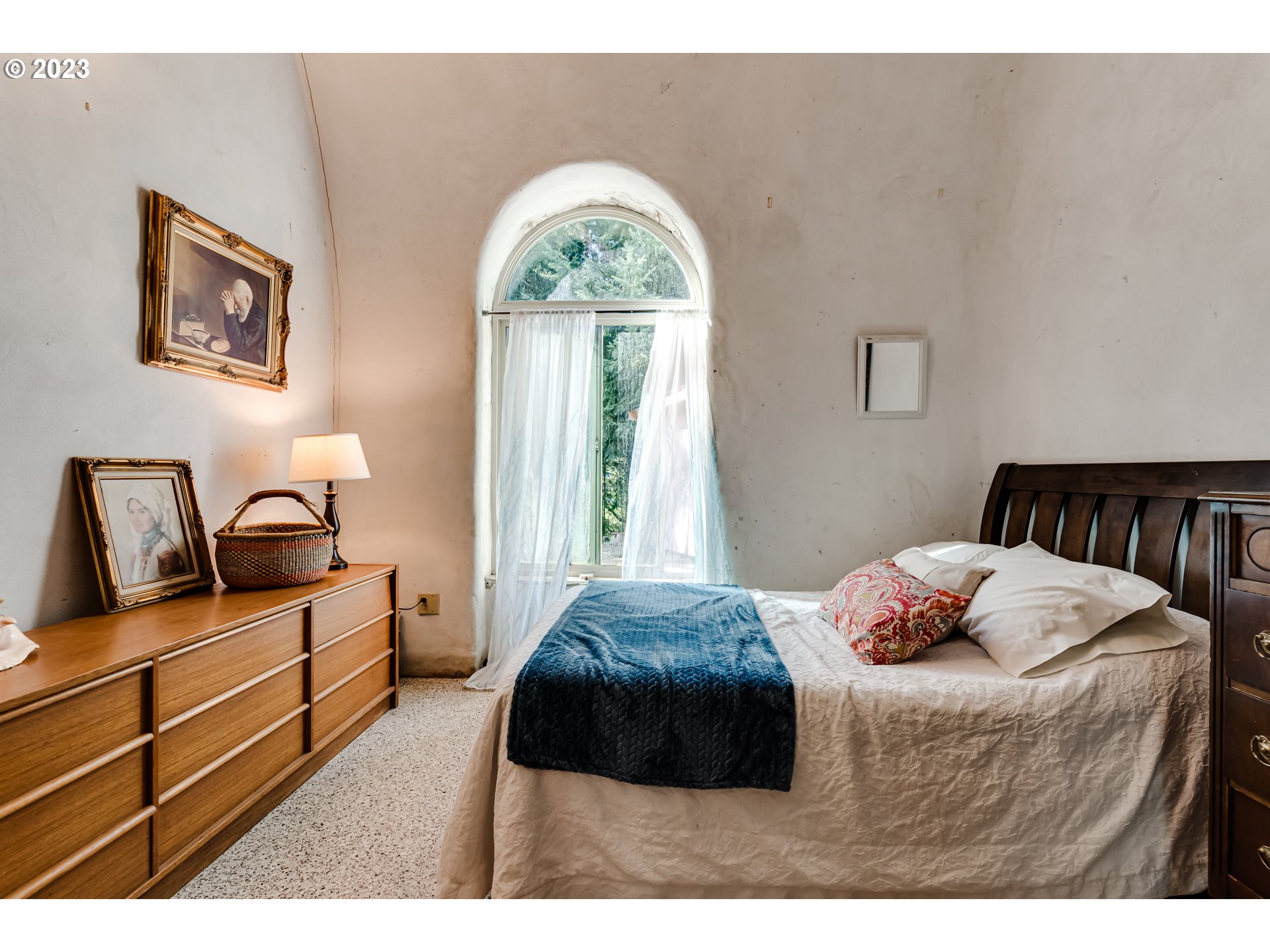 28375 Rainbow Valley Road Eugene, OR 97402 - Photo 9 of 21 a bedroom with a bed and a chandelier