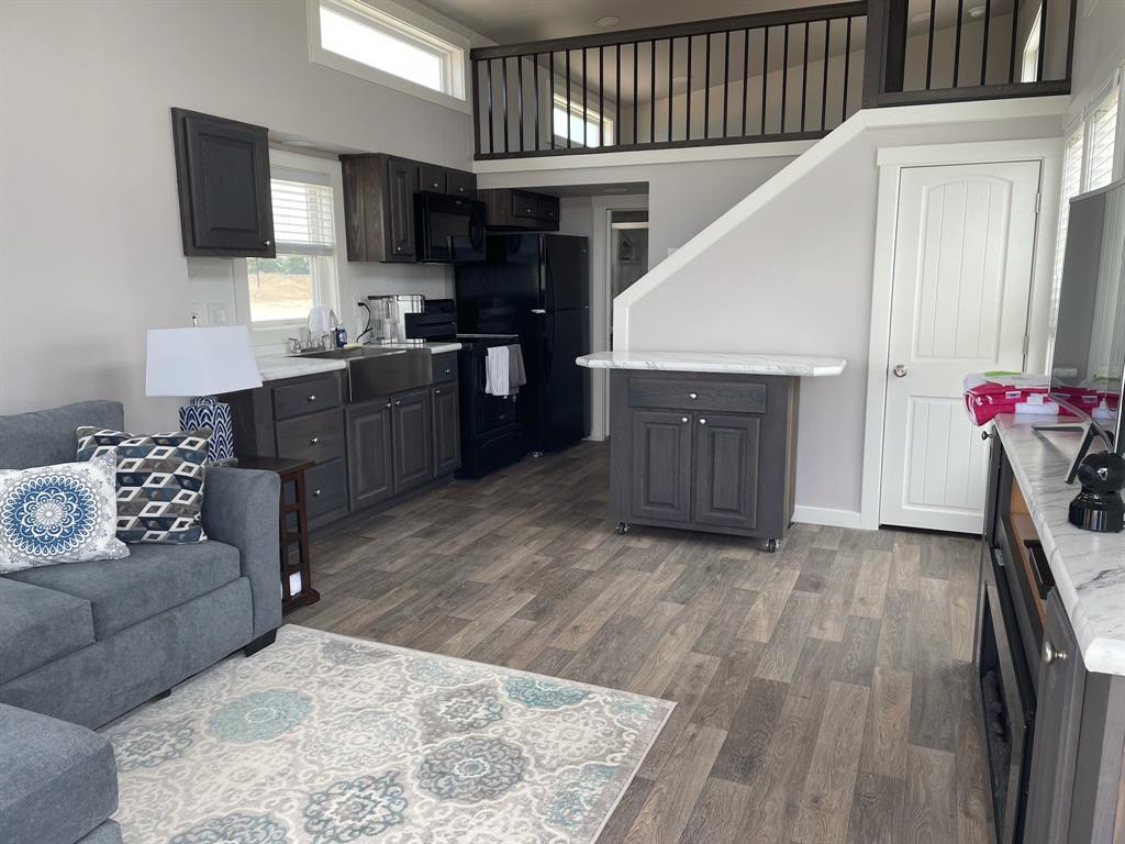 5226 Waterfront Road Kerens, TX 75144 - Photo 2 of 7 Living and Kitchen area with stairs leading to loft