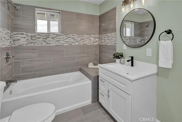 a view of balcony with couch and wooden fence