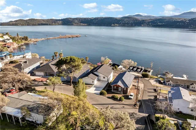 a view of a house with lake and mountain view