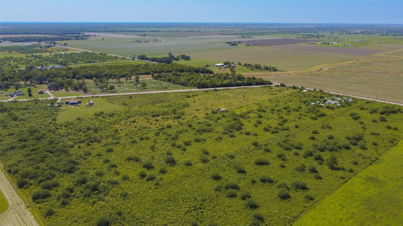 15415 Barak Road Guy, TX 77444 - Photo 3 of 10 Paved road frontage allows convenient access, with nearby agricultural tracts and ranch-style properties in the area