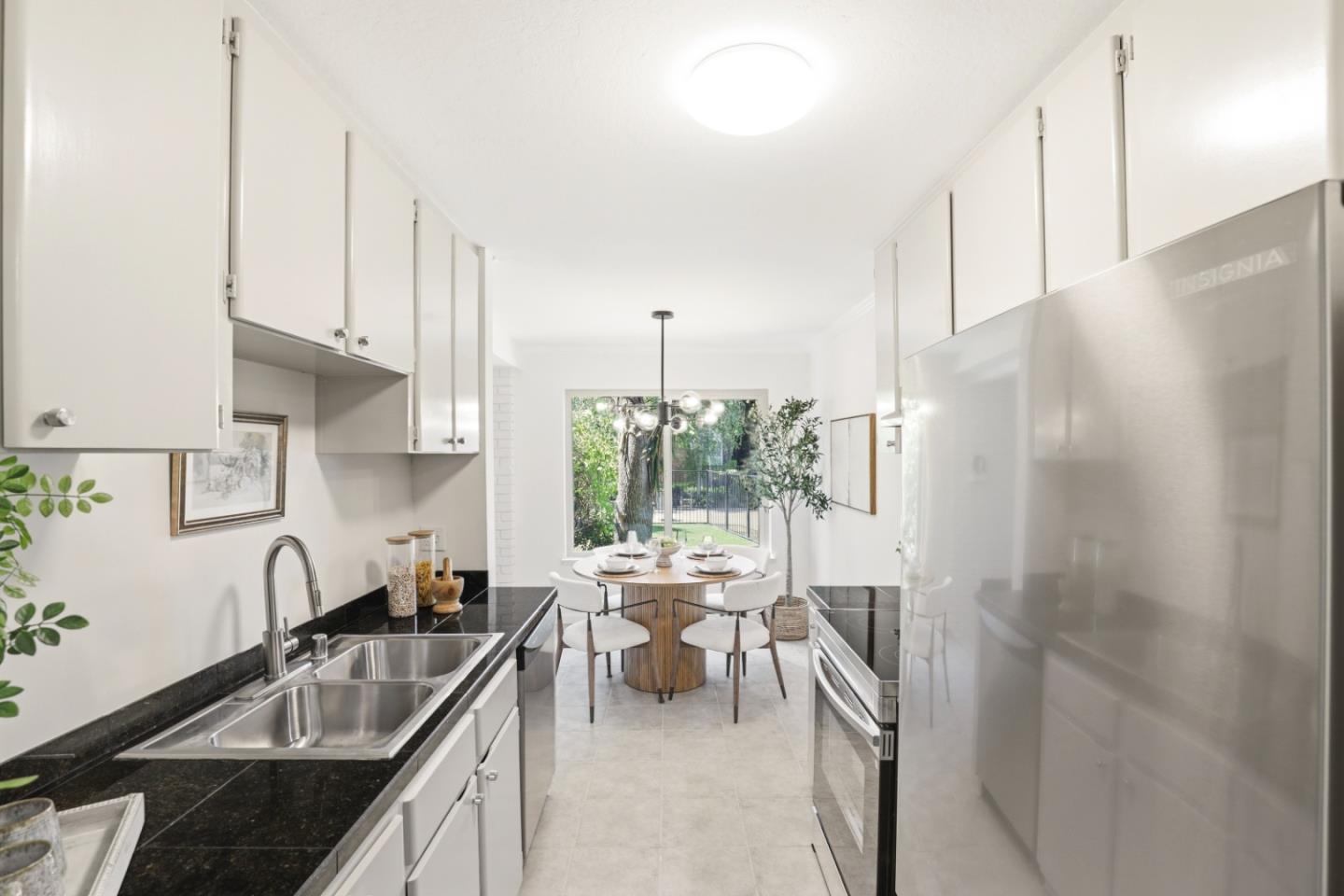 100 East Middlefield Road, Unit 3B Mountain View, CA 94043 - Photo 12 of 32 a kitchen with sink refrigerator and outdoor view