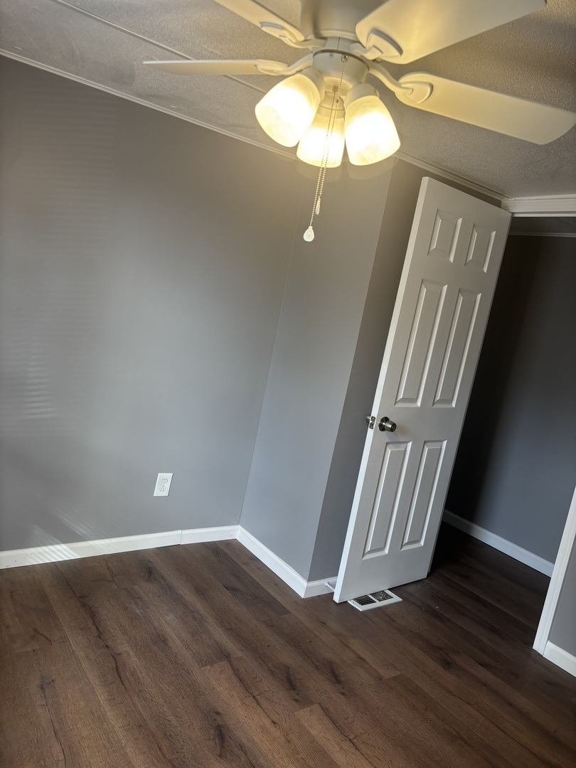 3 Franklin Drive Manteno, IL 60950 - Photo 17 of 23 a view of an empty room with wooden floor and windows