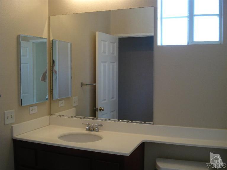 4543 Rivergate Court Riverside, CA 92505 - Photo 5 of 10 a bathroom with a sink and a mirror