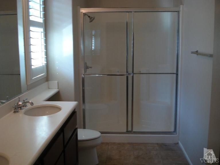 4543 Rivergate Court Riverside, CA 92505 - Photo 7 of 10 a bathroom with a sink toilet and vanity