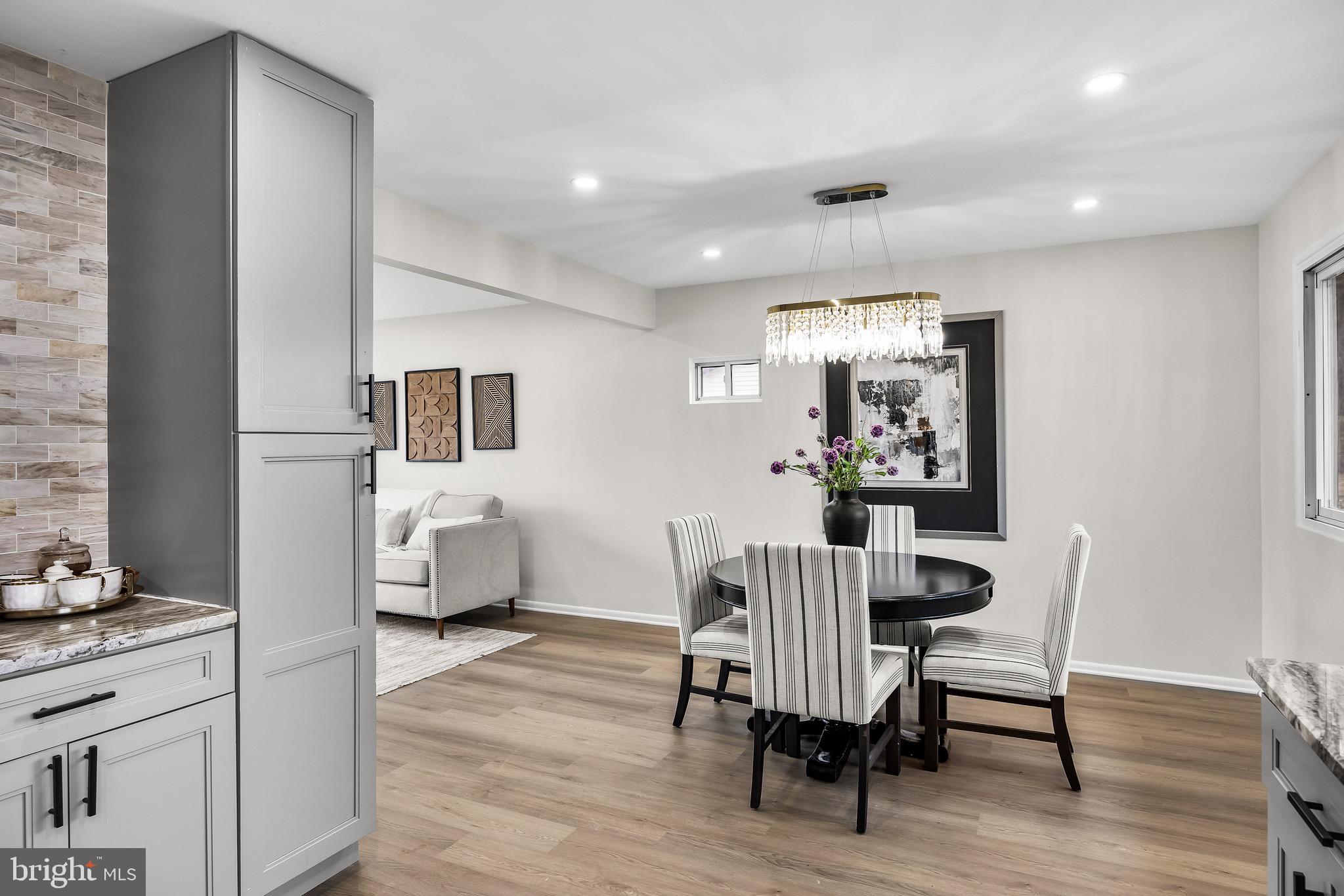 301 Cardinal Road Beverly, NJ 08010 - Photo 13 of 27 a view of a dining room with furniture and wooden floor