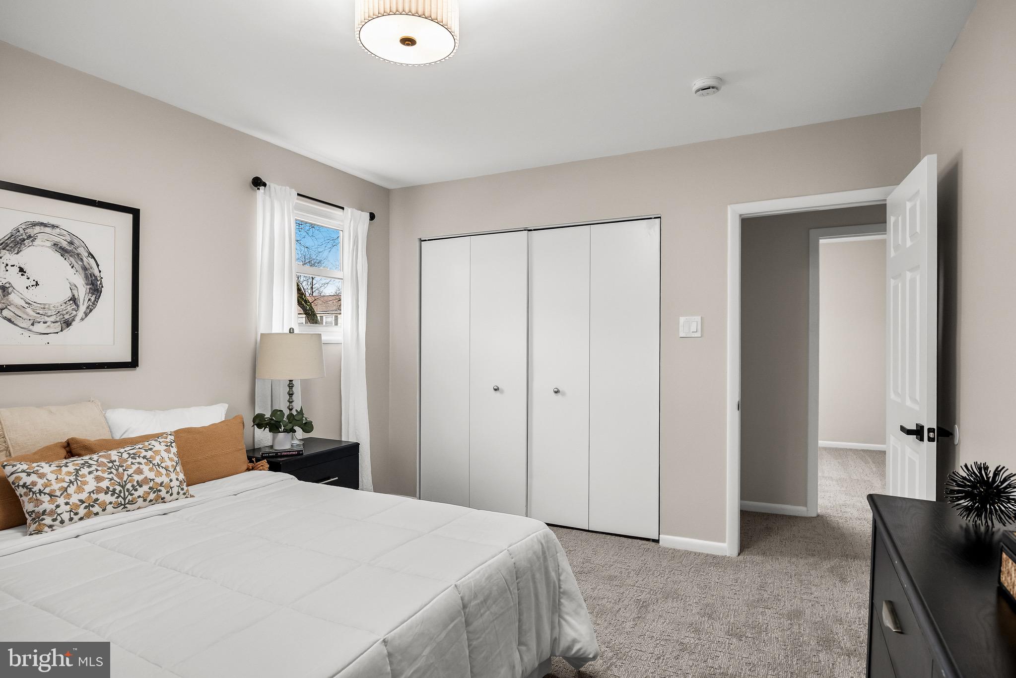 301 Cardinal Road Beverly, NJ 08010 - Photo 15 of 27 a bedroom with a bed and a cabinets