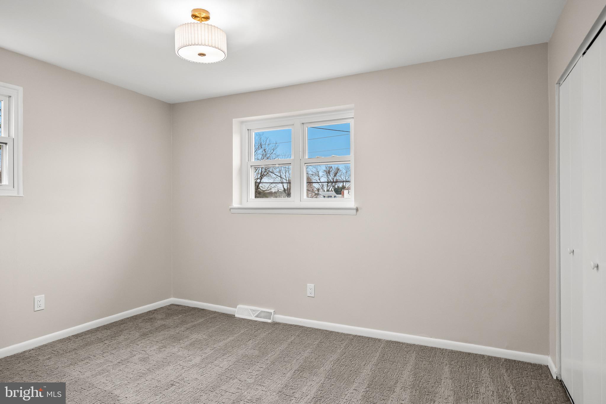 301 Cardinal Road Beverly, NJ 08010 - Photo 16 of 27 an empty room with a window