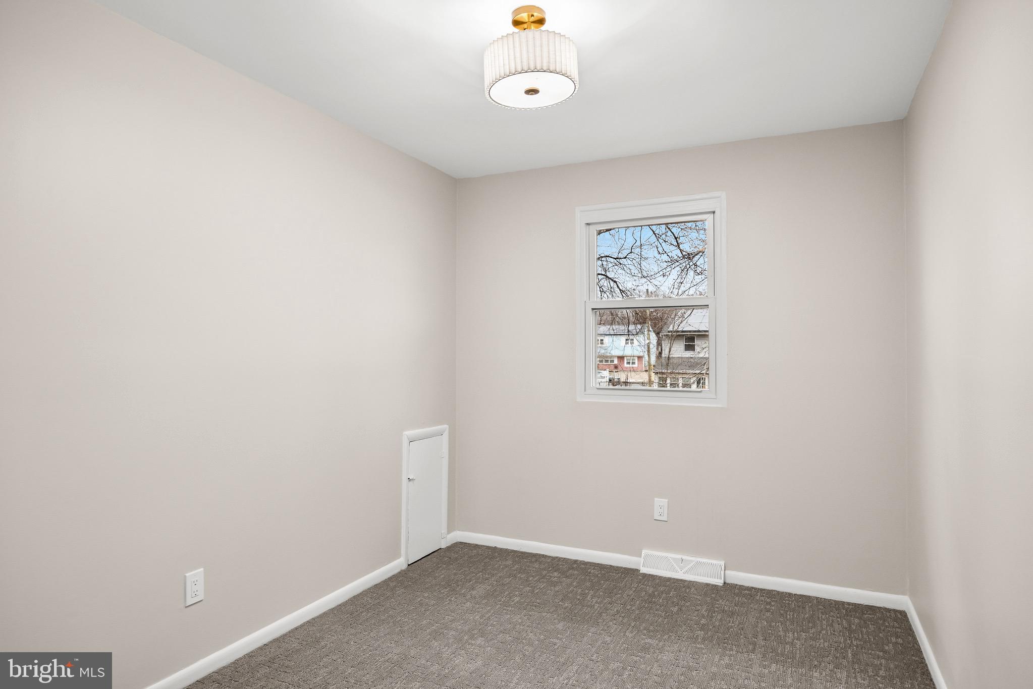 301 Cardinal Road Beverly, NJ 08010 - Photo 17 of 27 an empty room with a fan