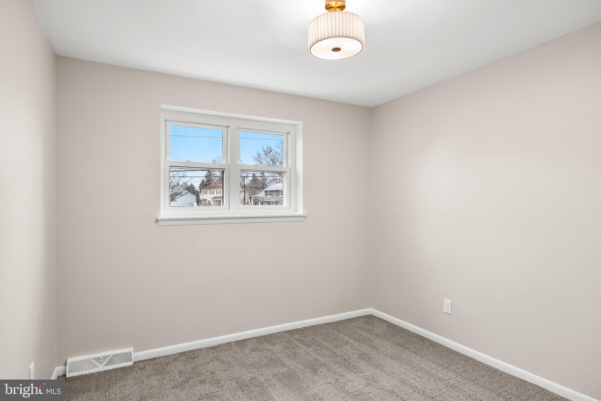301 Cardinal Road Beverly, NJ 08010 - Photo 18 of 27 an empty room with a window