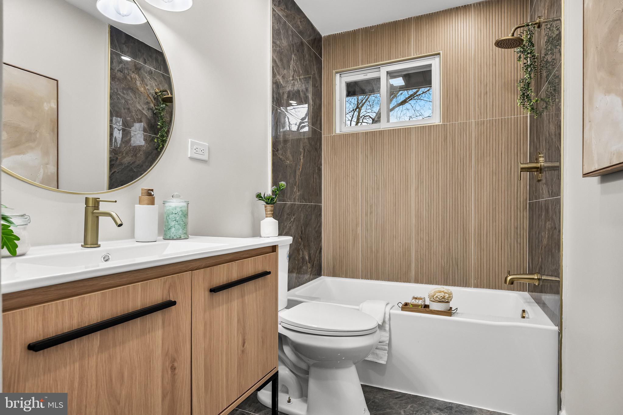 301 Cardinal Road Beverly, NJ 08010 - Photo 19 of 27 a bathroom with a sink a mirror and a toilet