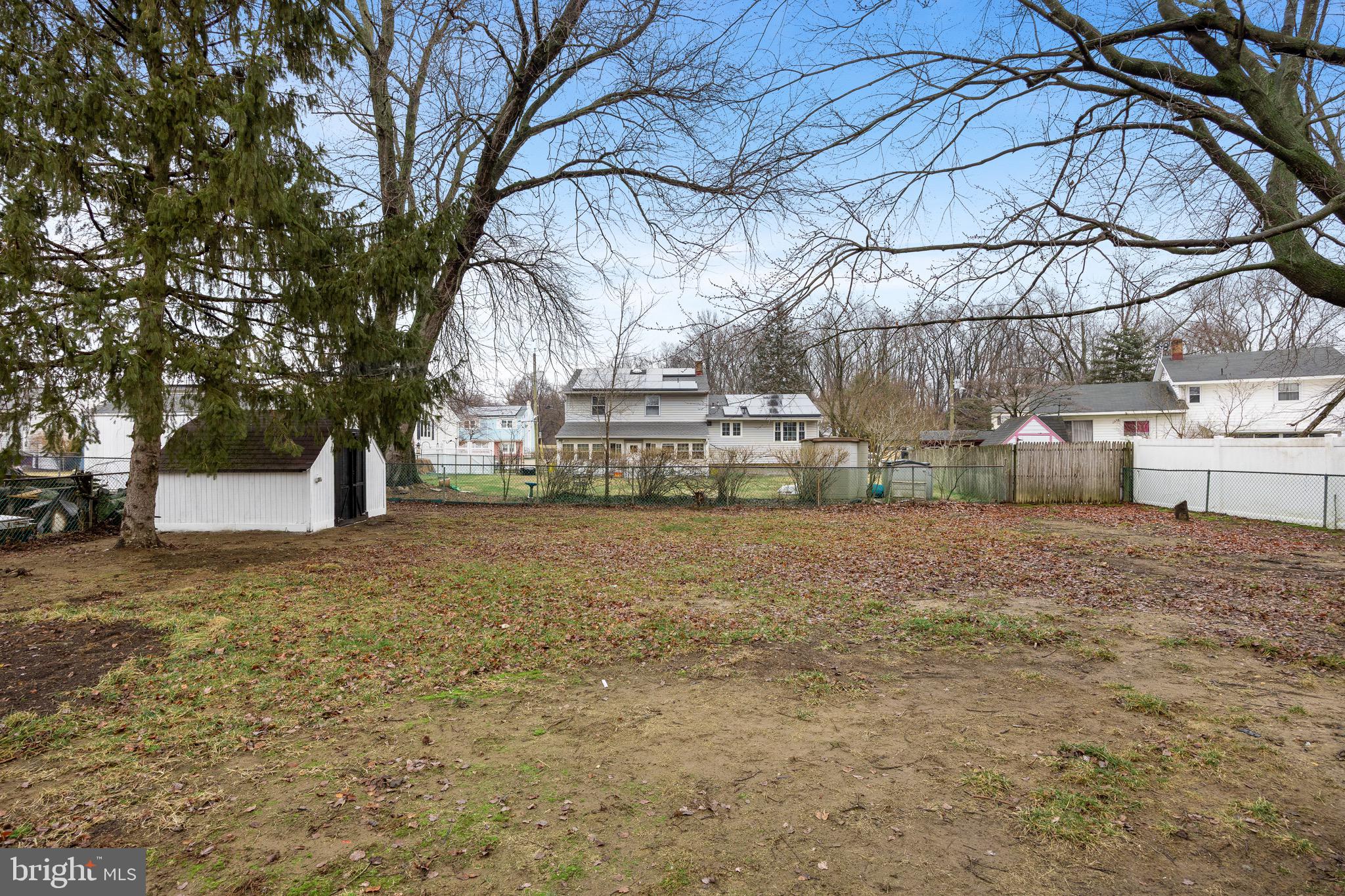 301 Cardinal Road Beverly, NJ 08010 - Photo 27 of 27 a view of a yard with a tree