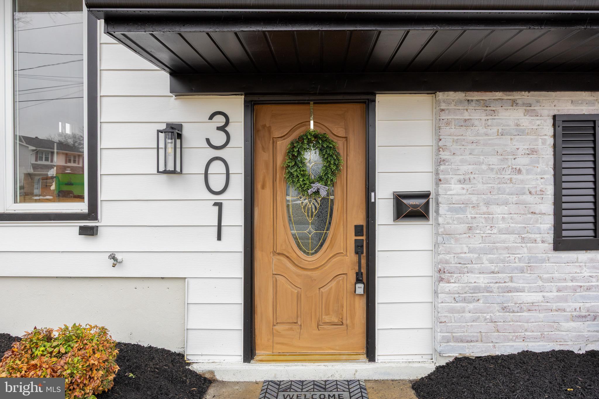 301 Cardinal Road Beverly, NJ 08010 - Photo 3 of 27 a front view of a house with a shower