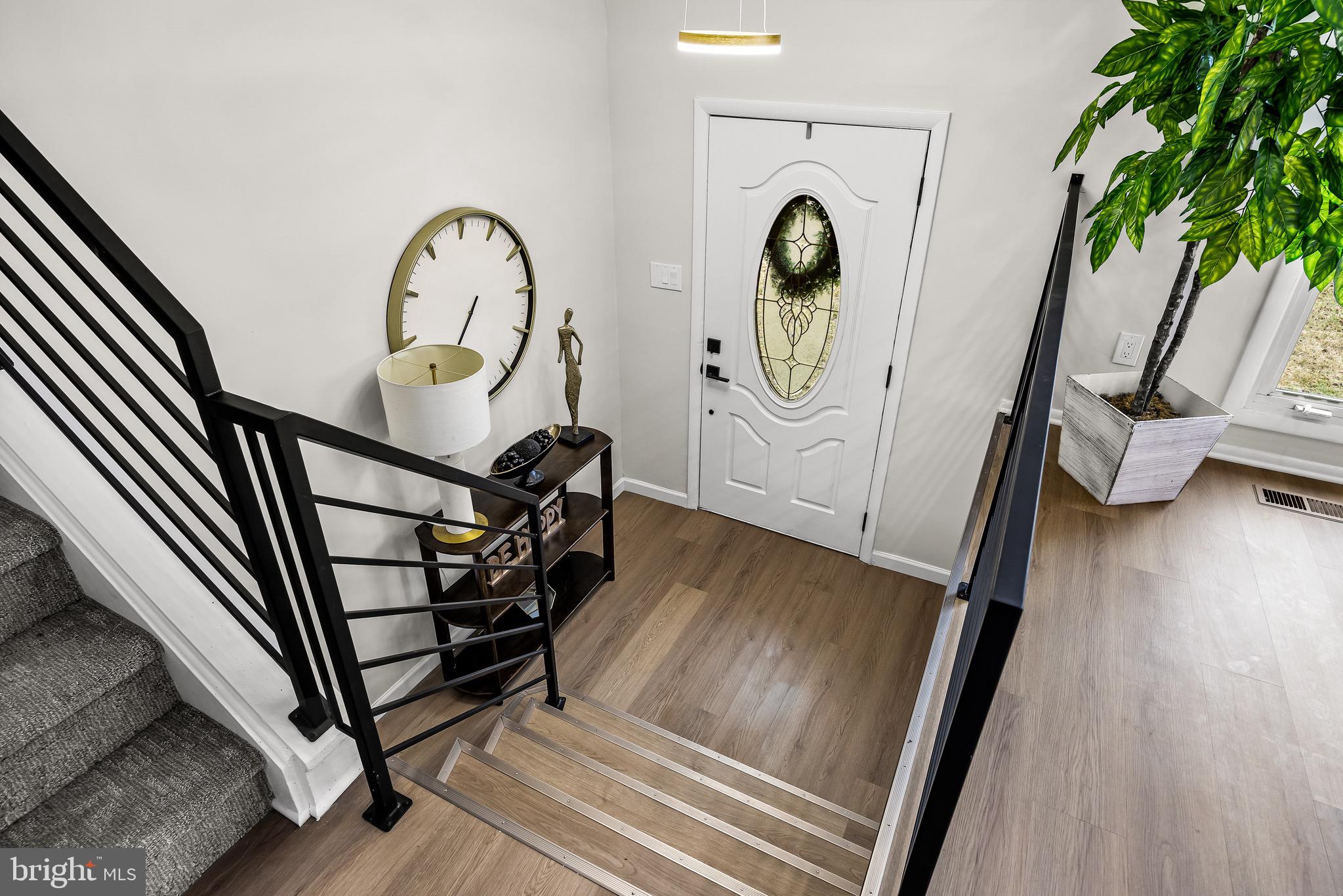 301 Cardinal Road Beverly, NJ 08010 - Photo 4 of 27 a view of an entryway with wooden floor