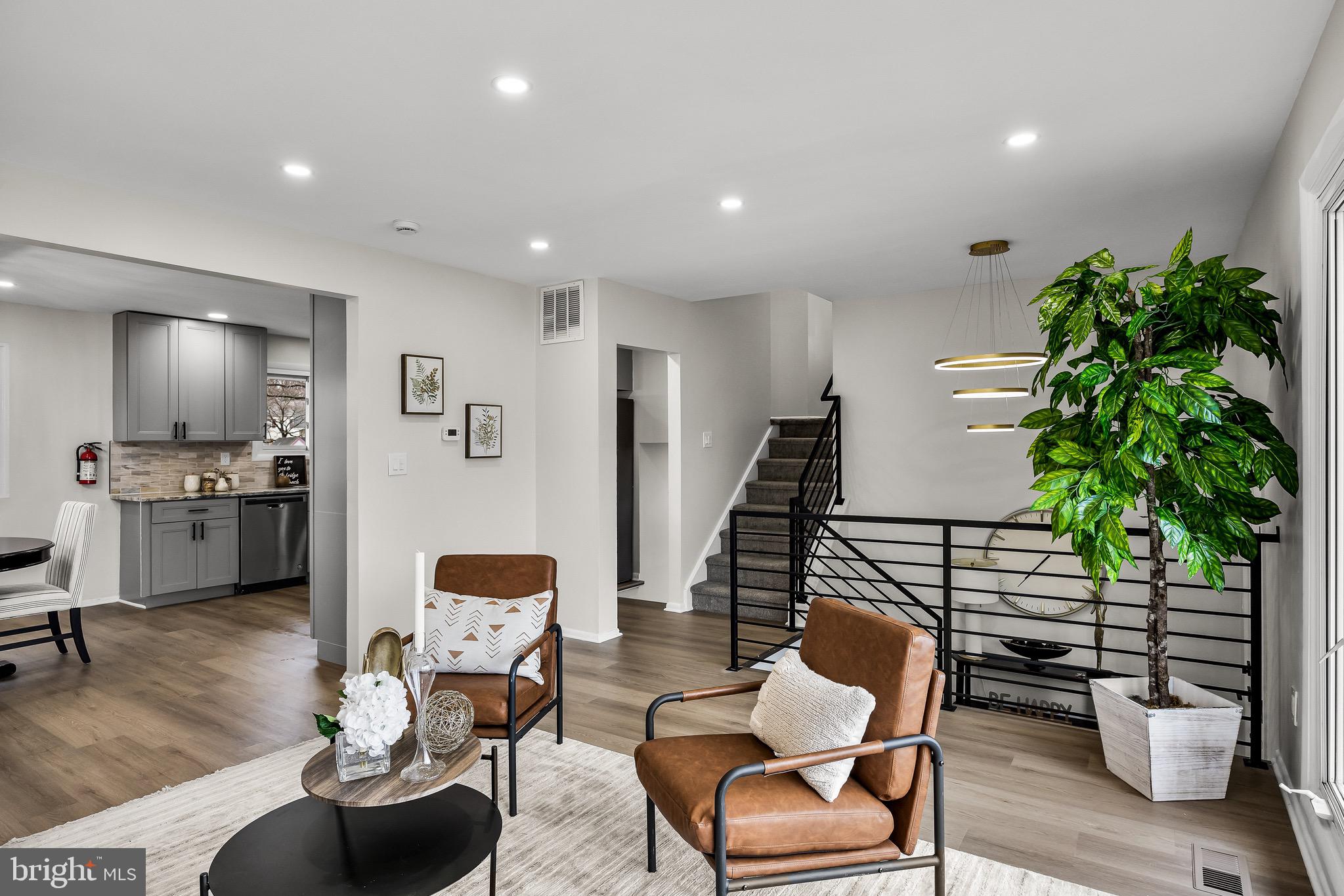 301 Cardinal Road Beverly, NJ 08010 - Photo 8 of 27 a living room with furniture and a potted plant