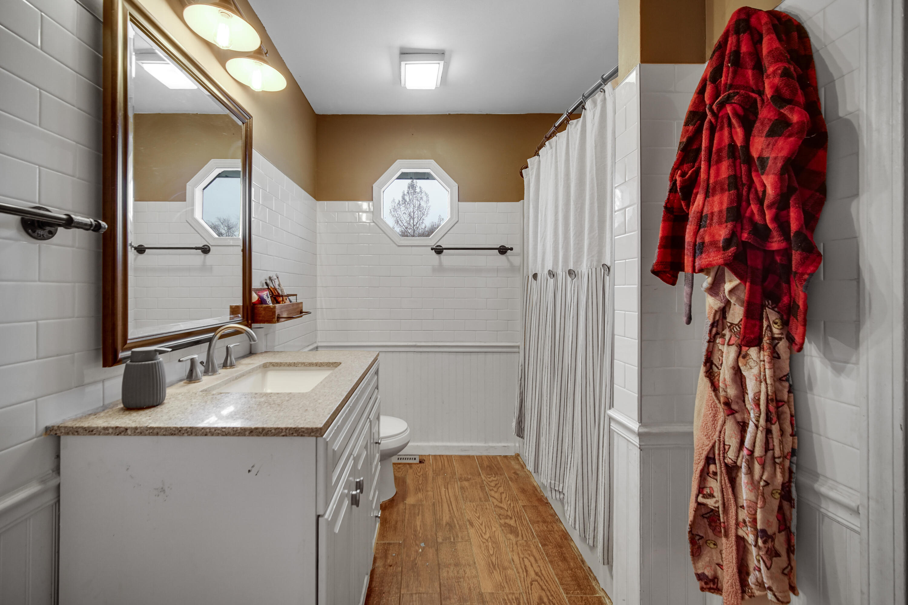 4038 Kingsway Drive Crown Point, IN 46307 - Photo 11 of 18 a bathroom with a sink and a mirror