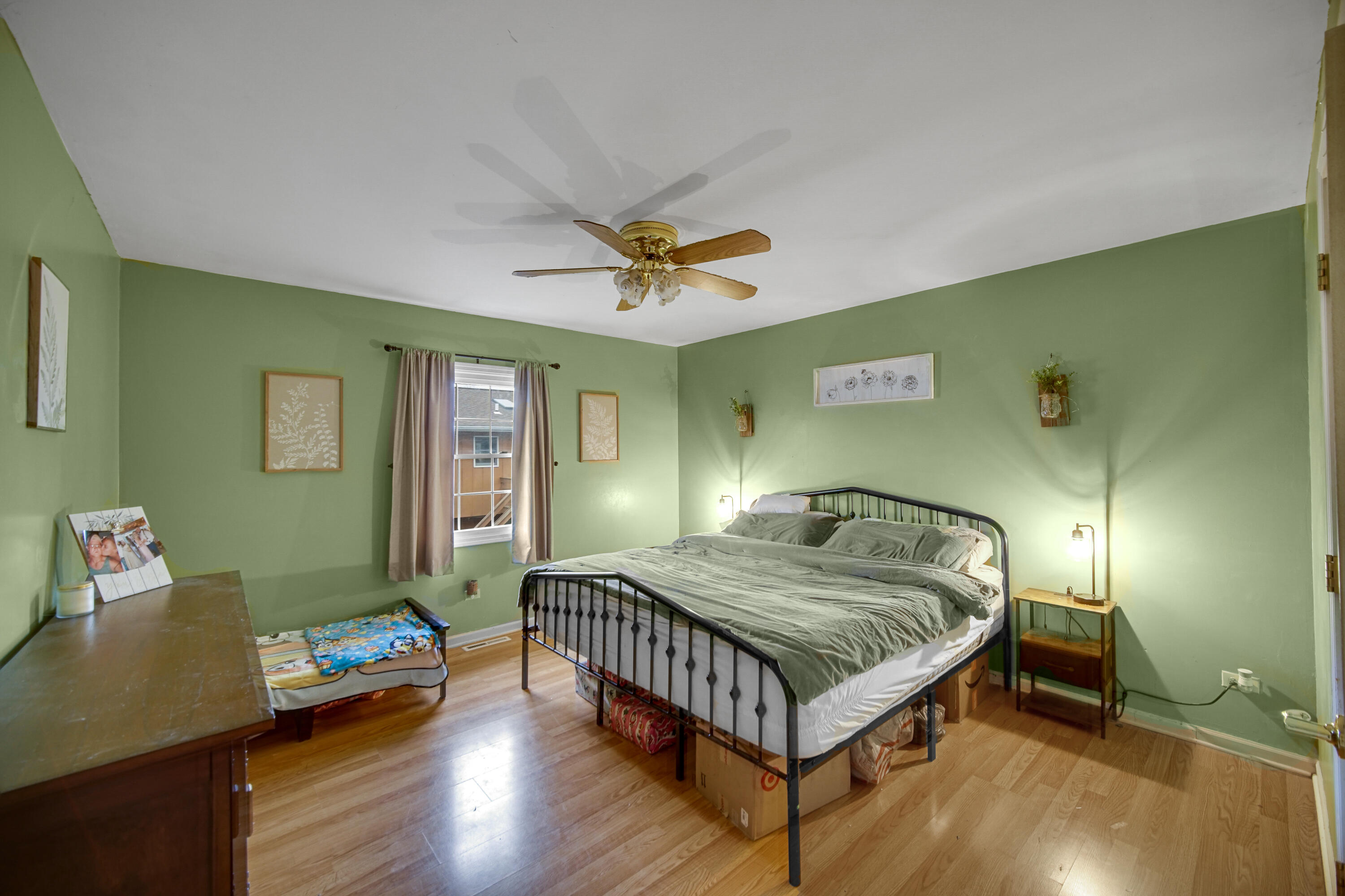 4038 Kingsway Drive Crown Point, IN 46307 - Photo 12 of 18 a bedroom with a bed and wooden floor