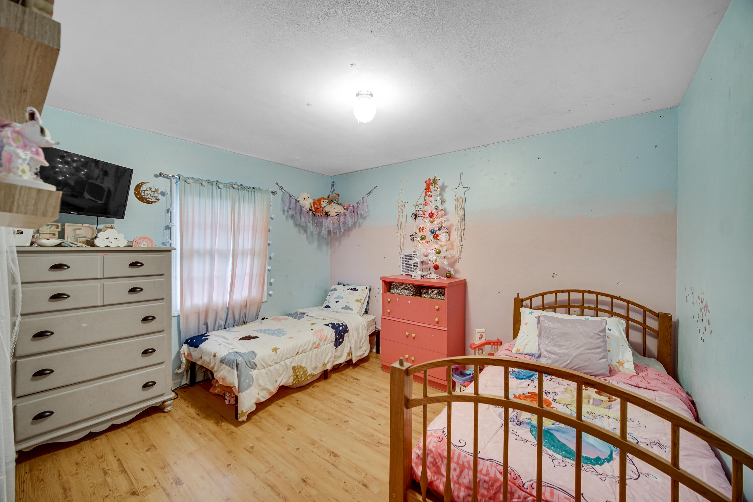 4038 Kingsway Drive Crown Point, IN 46307 - Photo 13 of 18 a bedroom with a bed and wooden floor