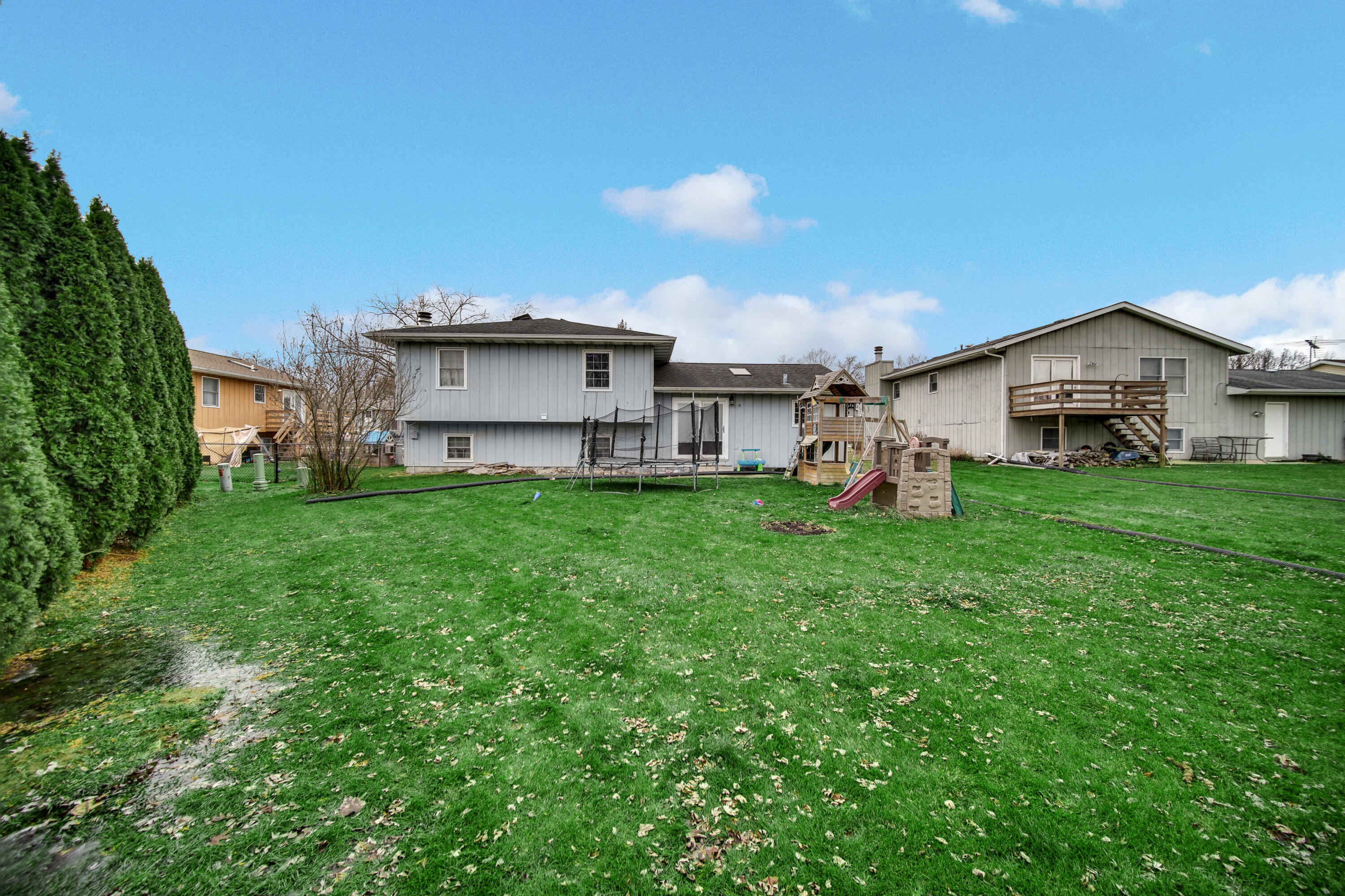 4038 Kingsway Drive Crown Point, IN 46307 - Photo 17 of 18 a view of a house with a yard