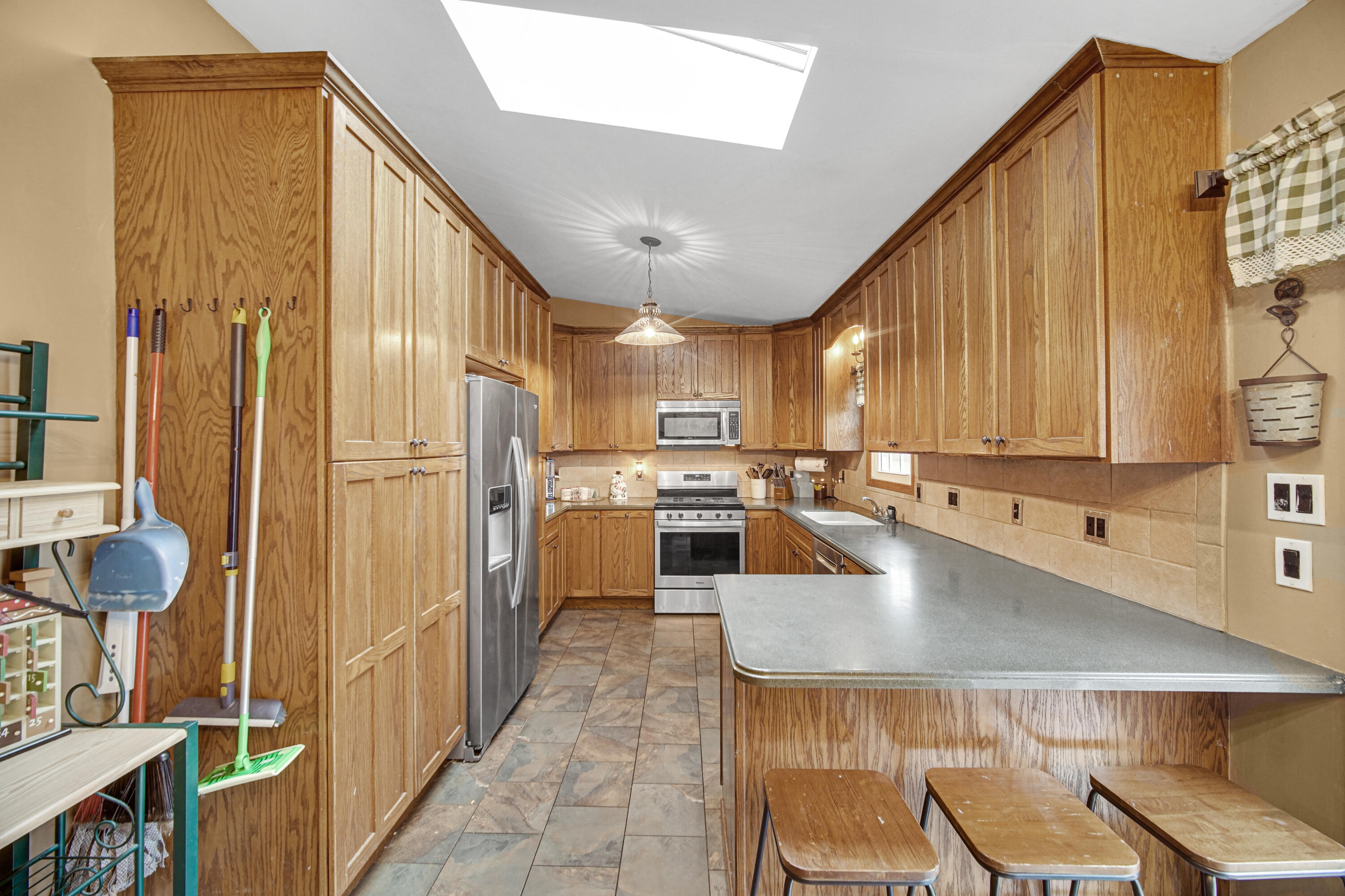4038 Kingsway Drive Crown Point, IN 46307 - Photo 4 of 18 a large kitchen with stainless steel appliances lots of counter space and breakfast area