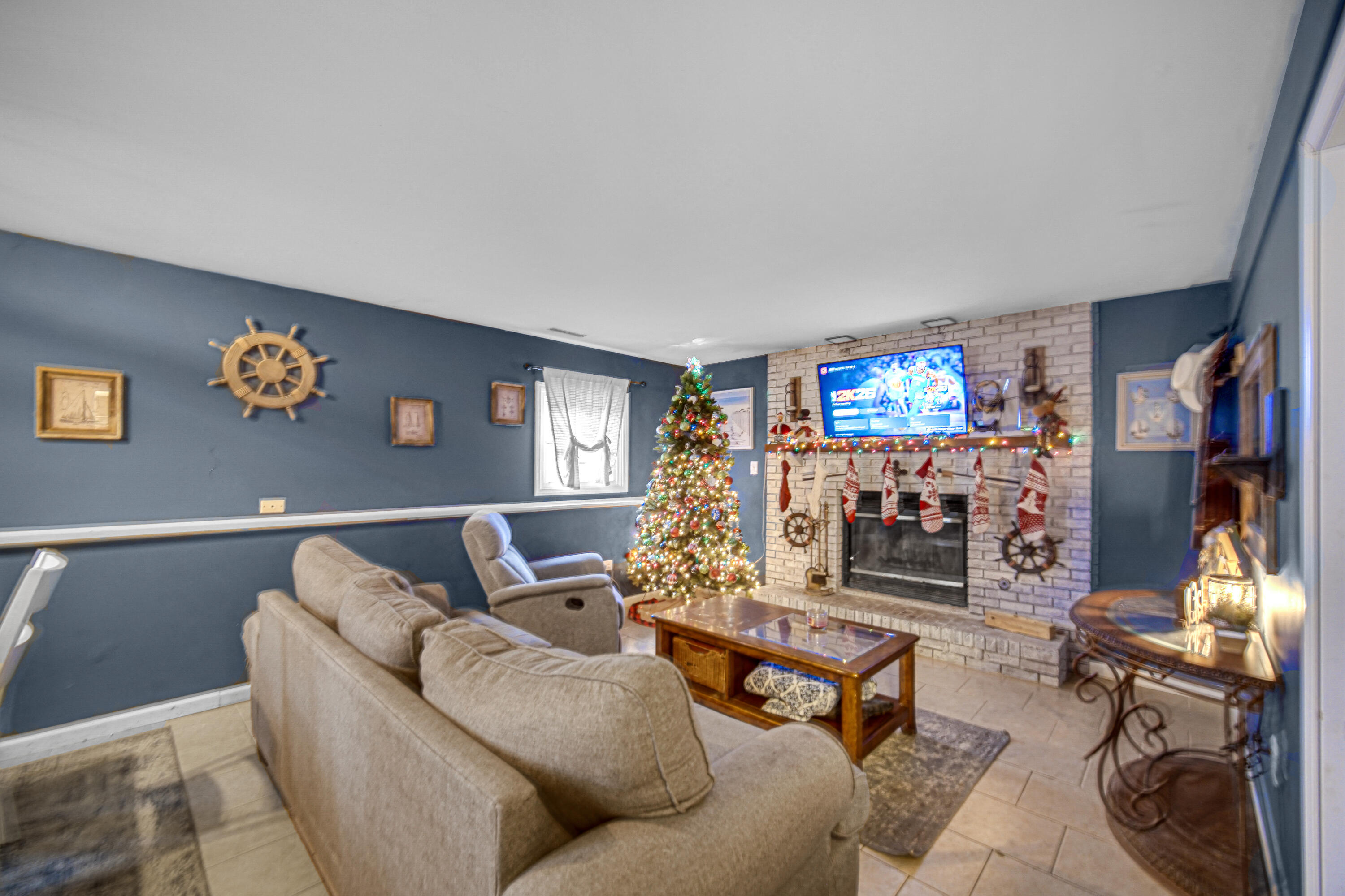 4038 Kingsway Drive Crown Point, IN 46307 - Photo 8 of 18 a living room with furniture and a flat screen tv with rug