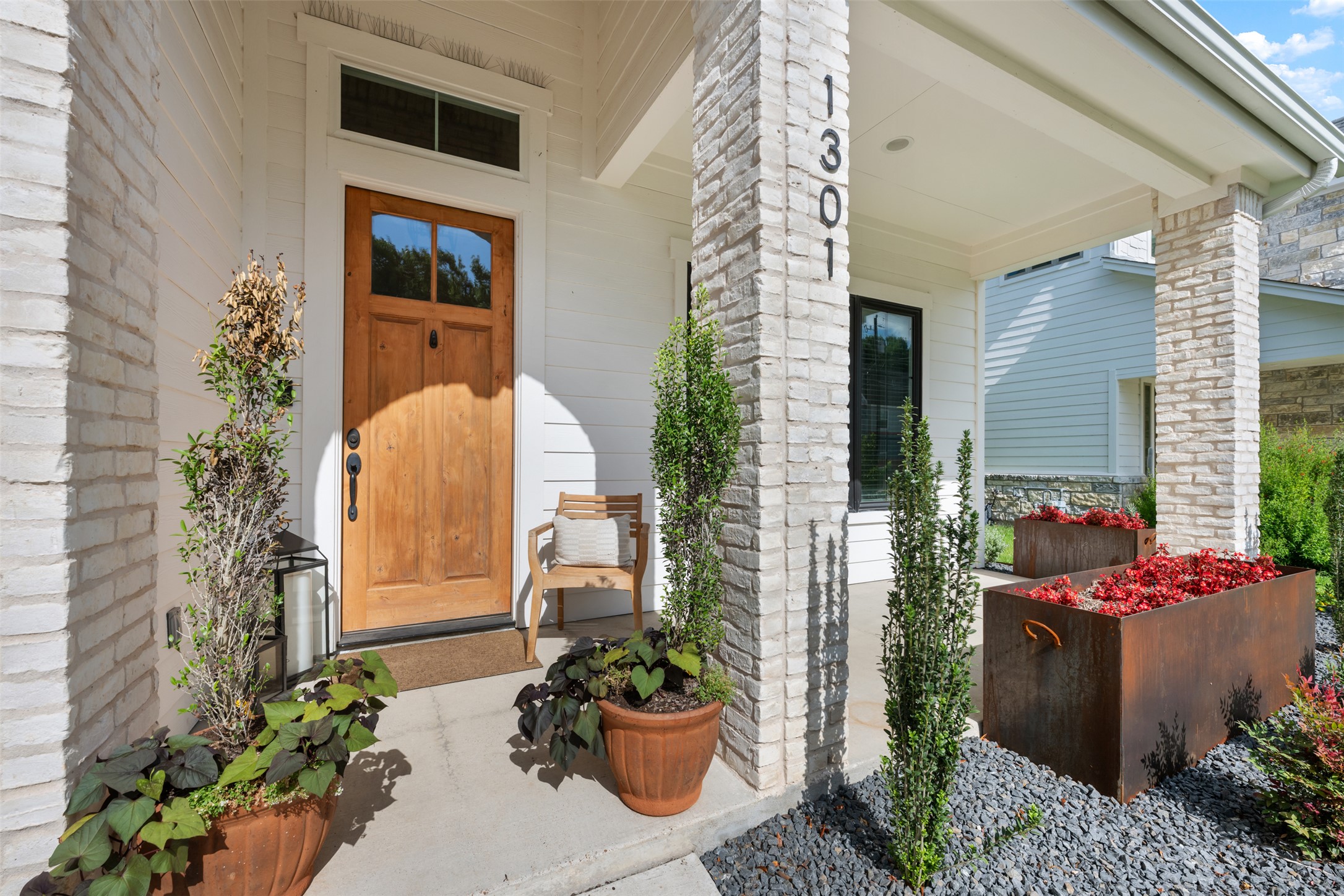 1301 West Street Georgetown, TX 78626 - Photo 4 of 40 A welcoming wooden front door with transom window accentuates this inviting porch entry.