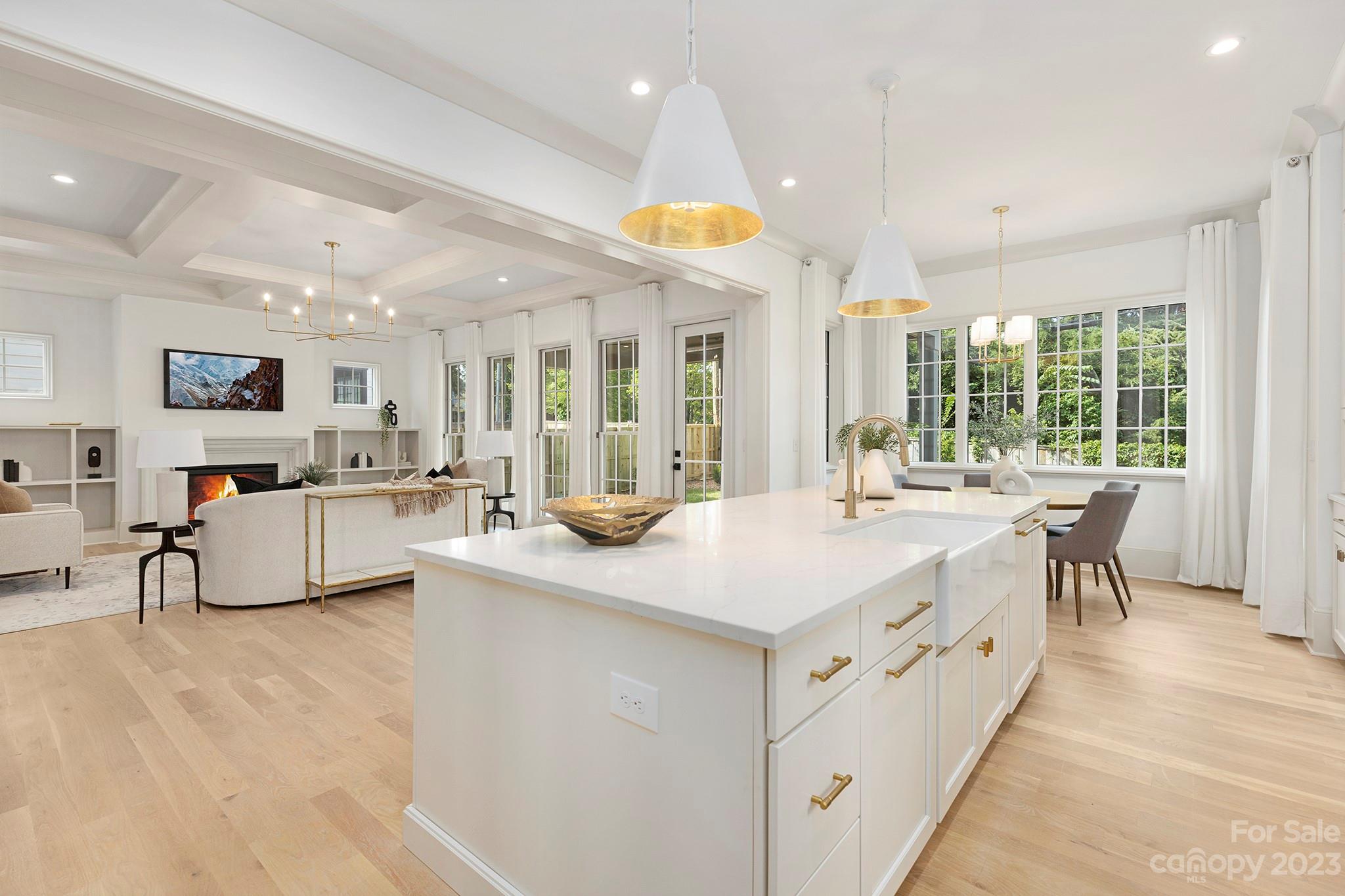 1213 Reece Road Charlotte, NC 28209 - Photo 12 of 31 a living room with stainless steel appliances kitchen island a large counter top space a large window cabinets and a counter top space