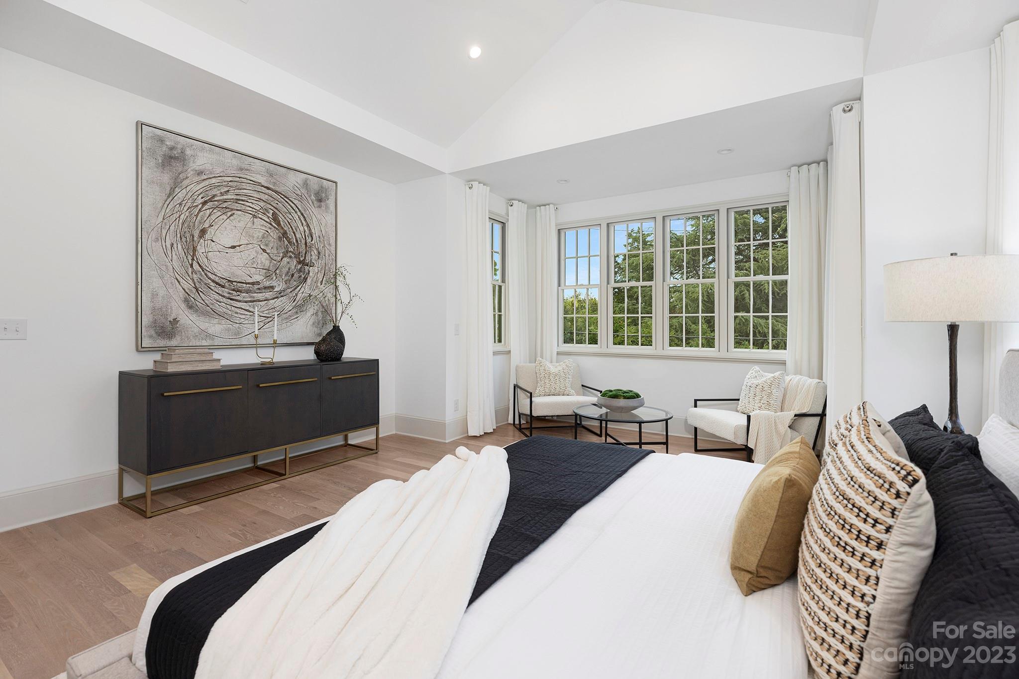 1213 Reece Road Charlotte, NC 28209 - Photo 20 of 31 a bedroom with a bed and a couch