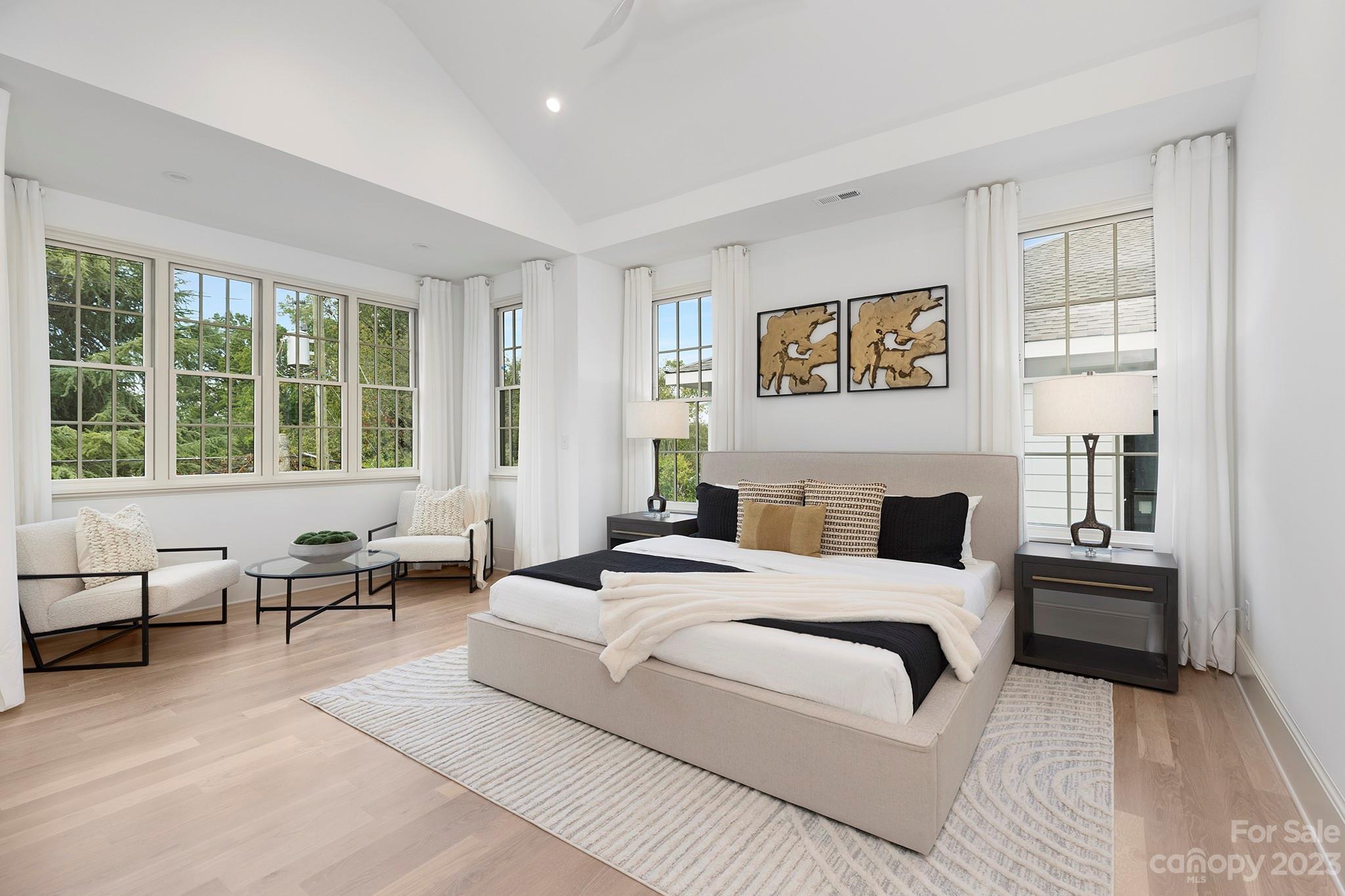 1213 Reece Road Charlotte, NC 28209 - Photo 21 of 31 a bedroom with a bed and a couch