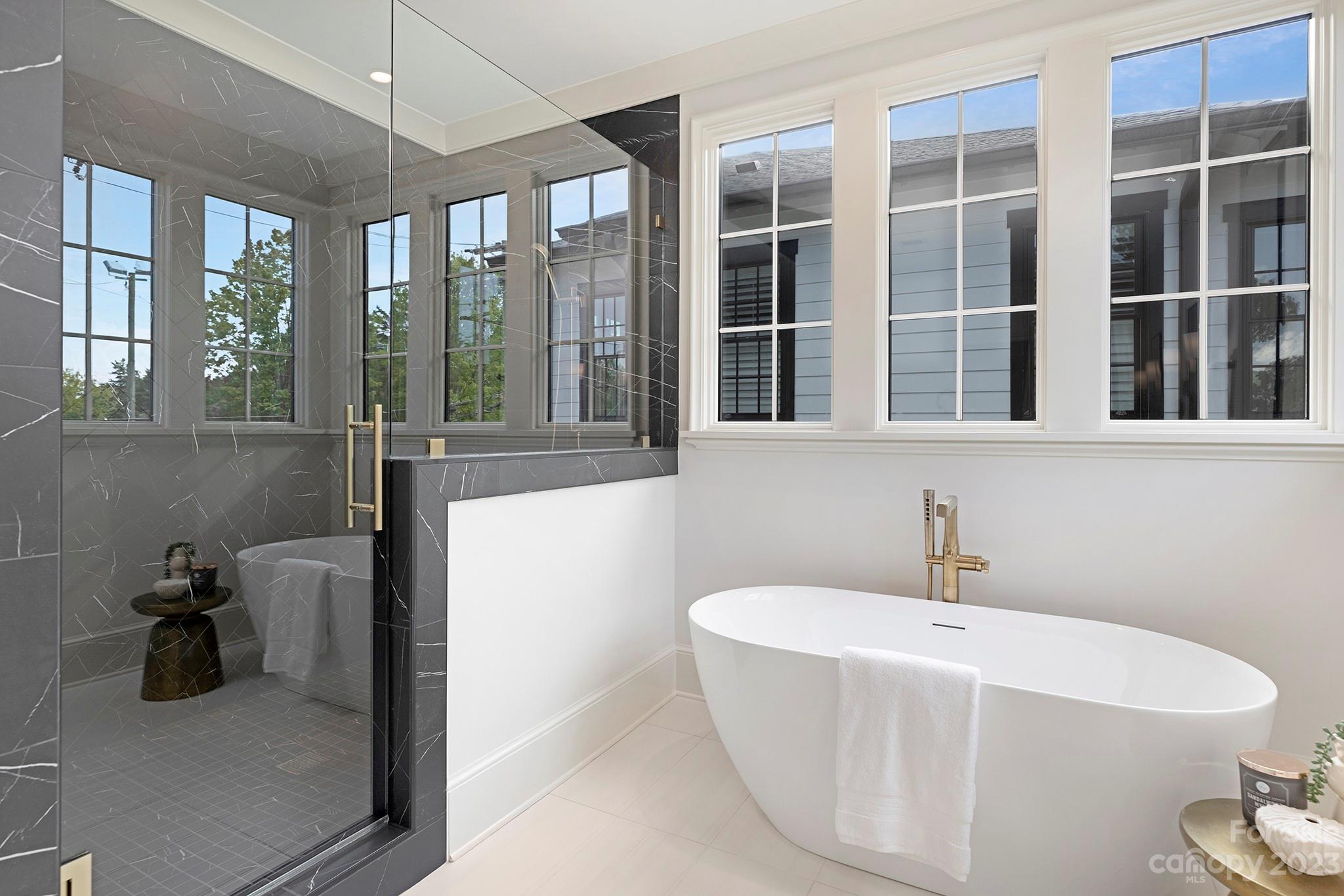 1213 Reece Road Charlotte, NC 28209 - Photo 24 of 31 a bathroom with a bathtub and a sink