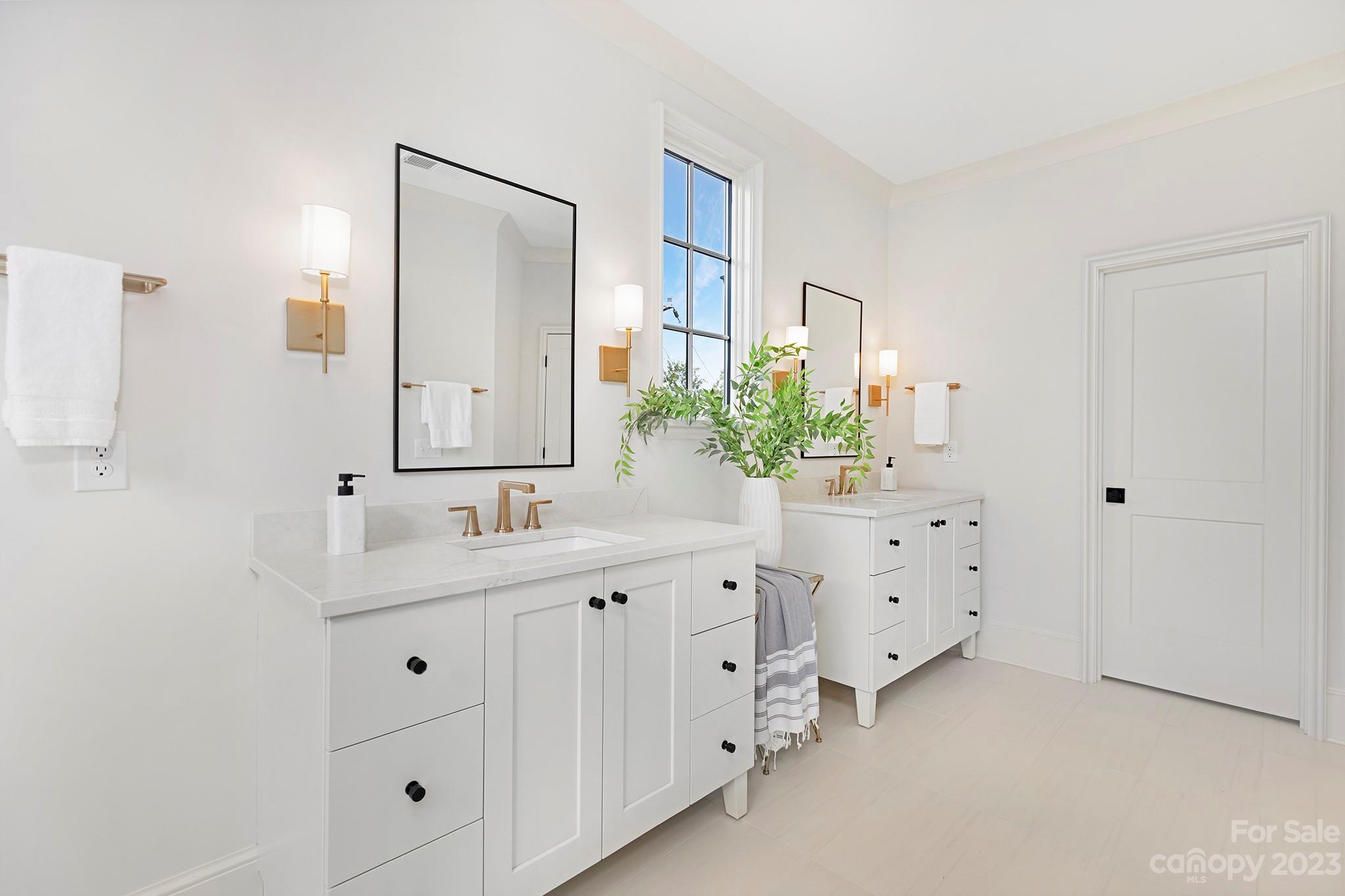 1213 Reece Road Charlotte, NC 28209 - Photo 25 of 31 a bathroom with a sink vanity and mirror