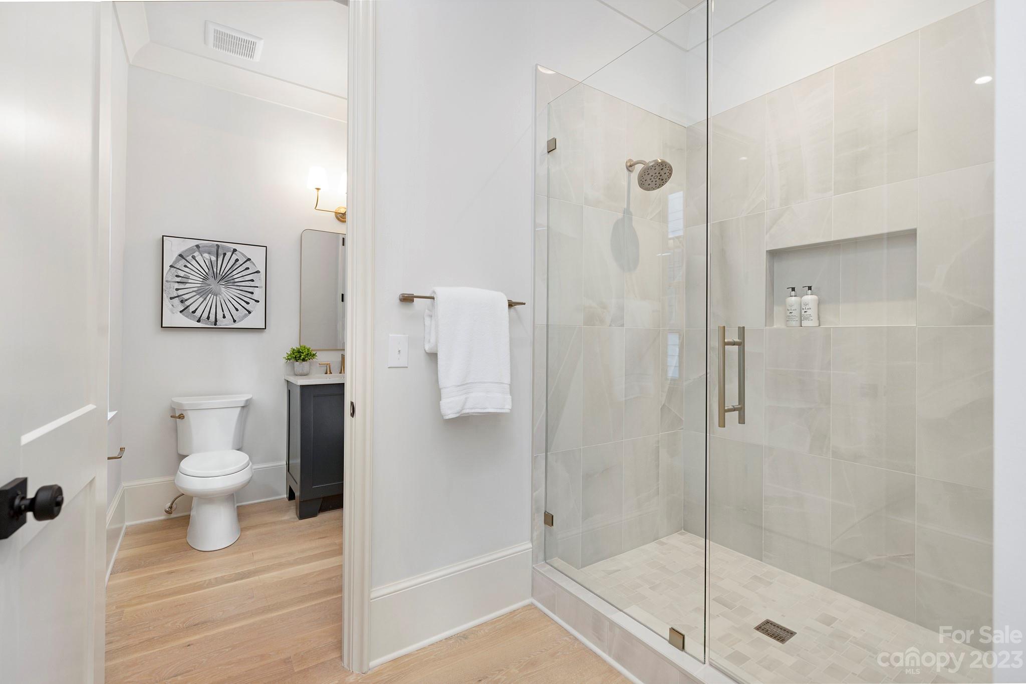 1213 Reece Road Charlotte, NC 28209 - Photo 26 of 31 a bathroom with a shower and a toilet