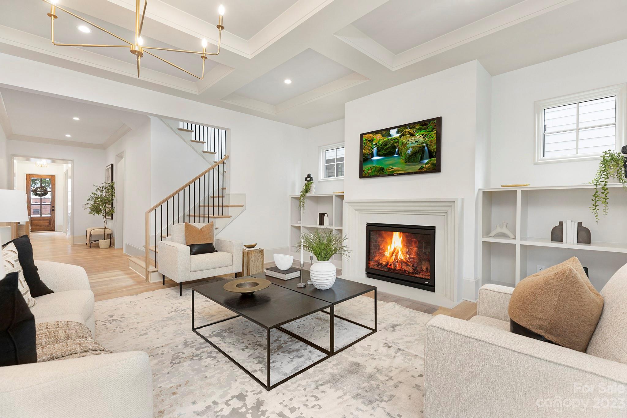 1213 Reece Road Charlotte, NC 28209 - Photo 6 of 31 a living room with furniture a flat screen tv and a fireplace