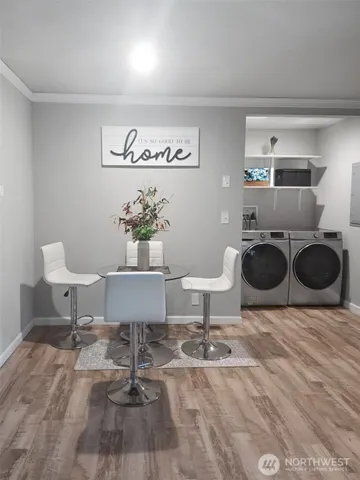 a living room with furniture a rug and a table