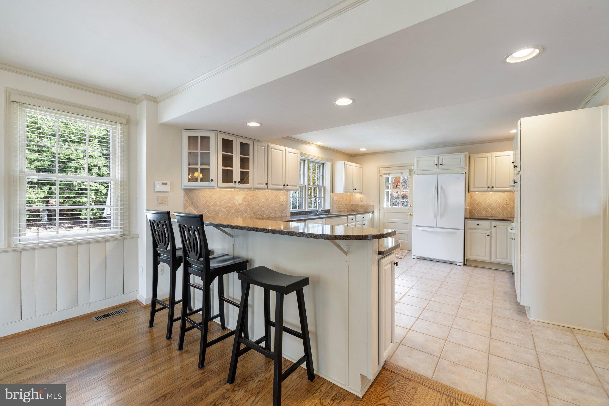 17970 Raven Rocks Road Bluemont, VA 20135 - Photo 15 of 78 a kitchen with a table and chairs in it