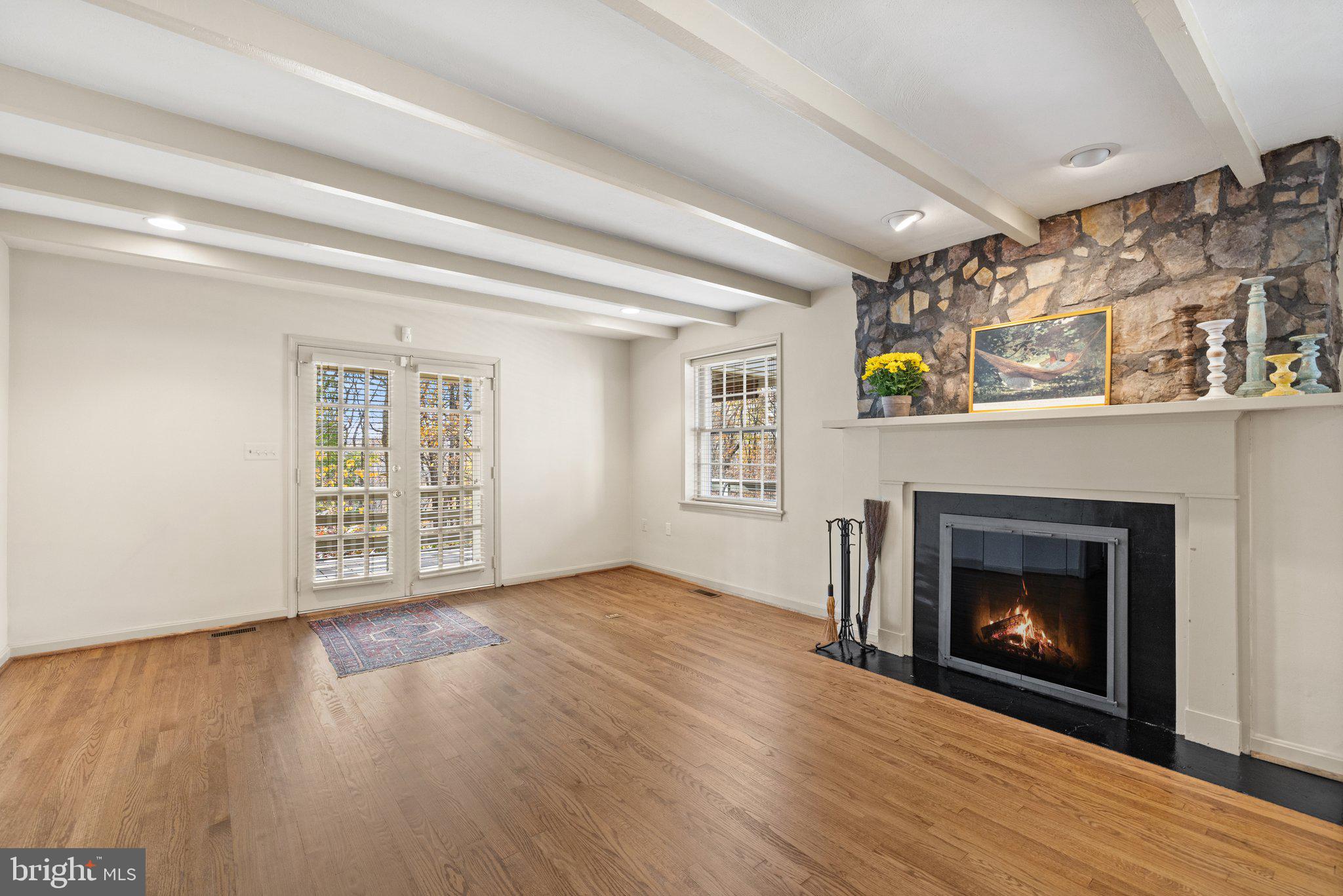 17970 Raven Rocks Road Bluemont, VA 20135 - Photo 21 of 78 a view of an empty room with wooden floor fireplace and a window