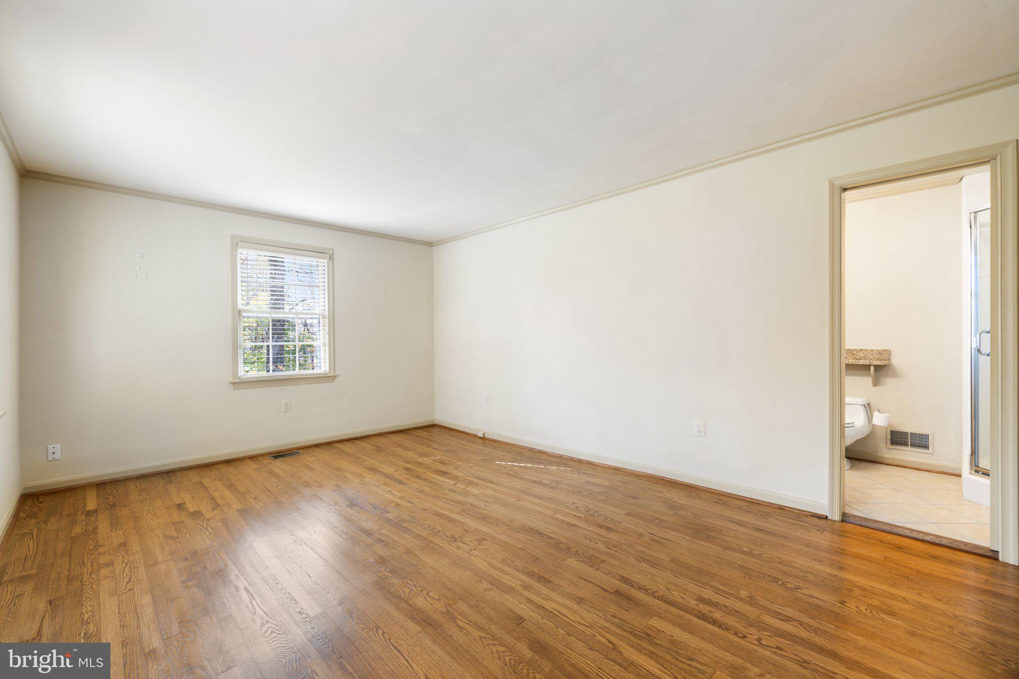 17970 Raven Rocks Road Bluemont, VA 20135 - Photo 38 of 78 an empty room with wooden floor and windows
