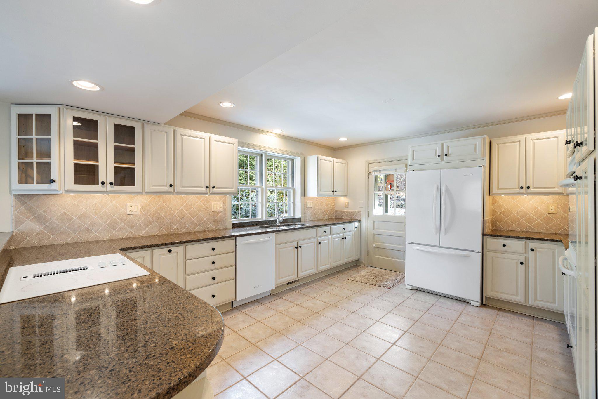 17970 Raven Rocks Road Bluemont, VA 20135 - Photo 9 of 78 a kitchen with a cabinets and refrigerator