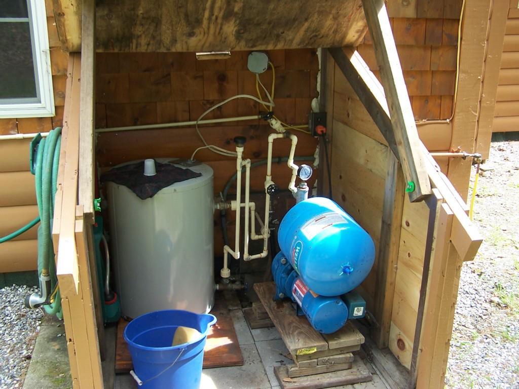 498 Gore Road Bryant Pond, ME 04219 - Photo 29 of 30 Well pump and hot water heater