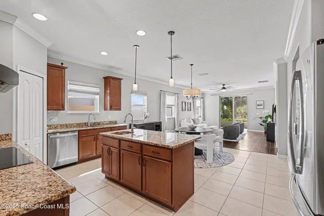 a large kitchen with kitchen island granite countertop a large counter top and sink