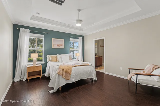 a bed room with a bed and a chair