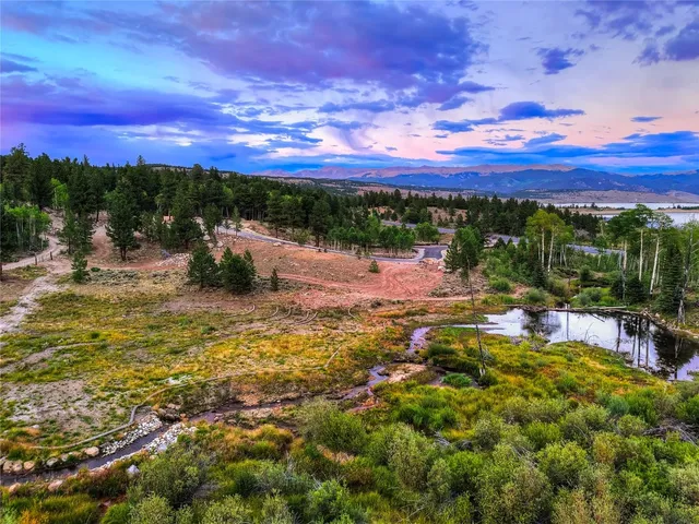 a view of a swimming pool with a table and chairs