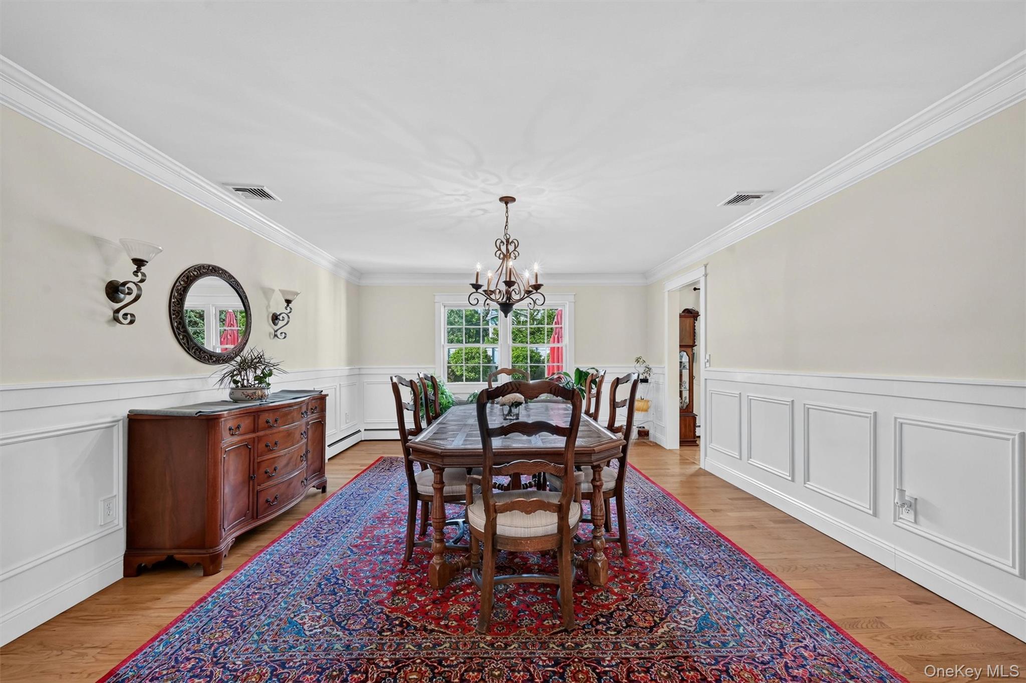 5 Hedges Road Warwick, NY 10990 - Photo 8 of 48 The spacious dining room features classic wainscoting, hardwood floors, and an elegant setting for holidays, gatherings, and everyday meals.