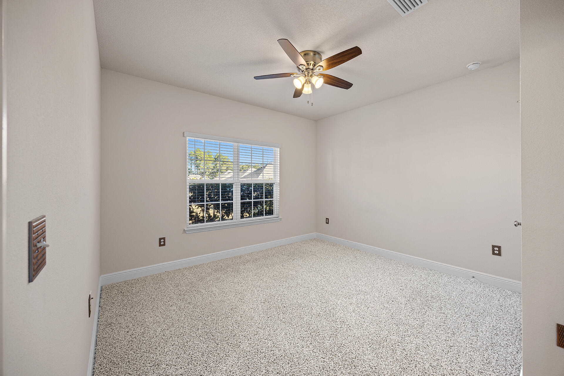 220 Conner Circle Santa Rosa Beach, FL 32459 - Photo 11 of 50 a view of an empty room with a window