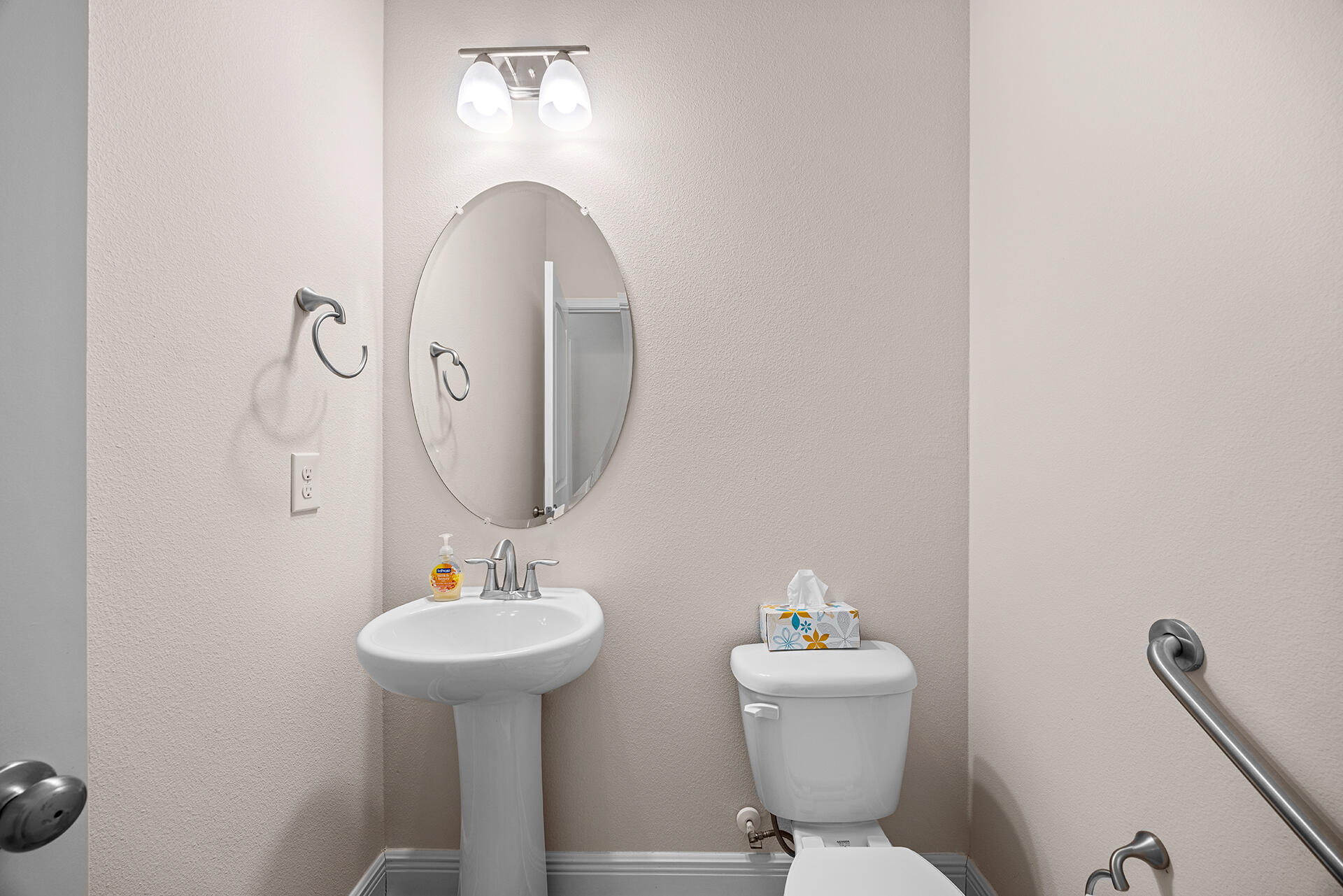 220 Conner Circle Santa Rosa Beach, FL 32459 - Photo 18 of 50 a bathroom with a toilet sink and mirror