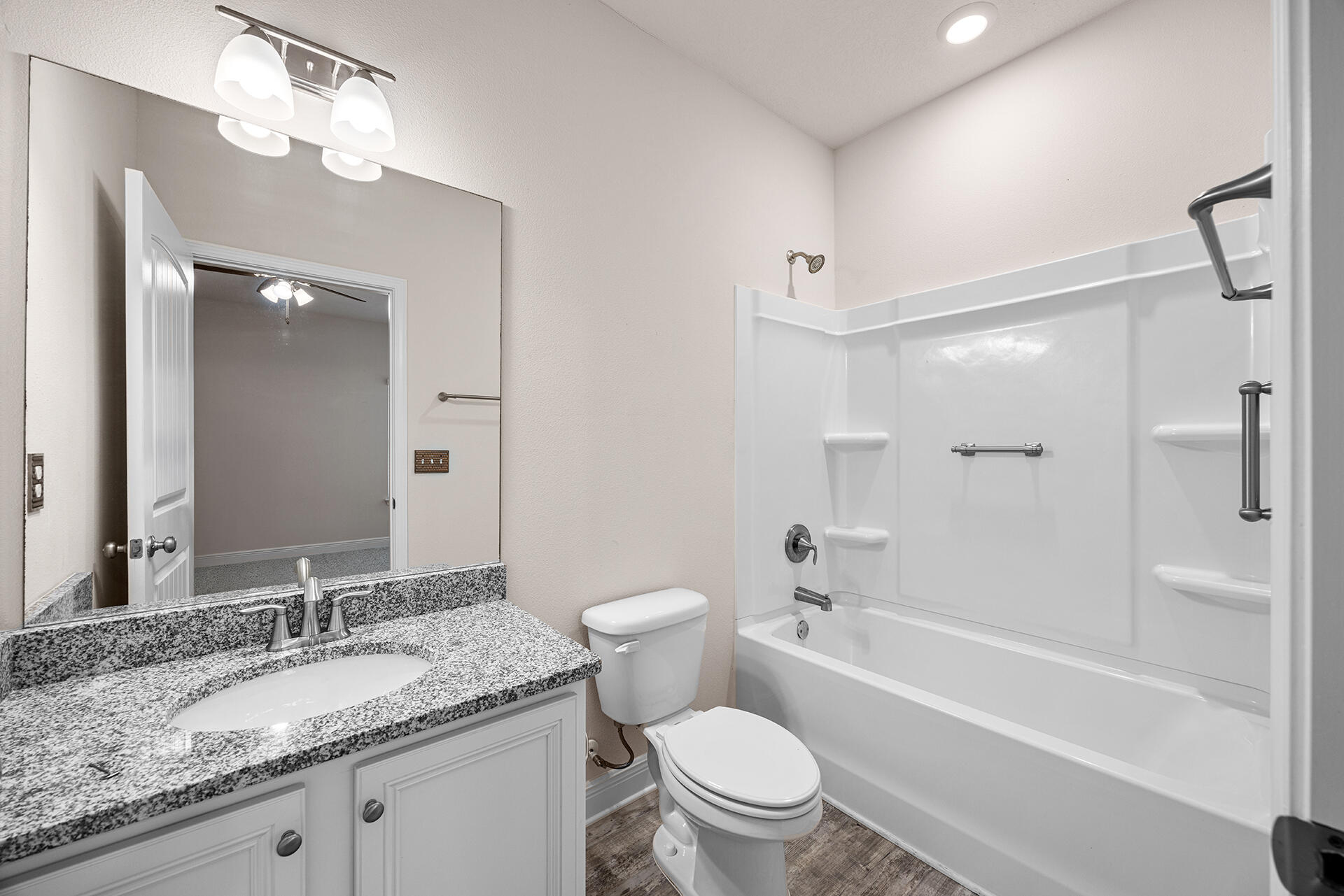 220 Conner Circle Santa Rosa Beach, FL 32459 - Photo 24 of 50 a bathroom with a granite countertop sink toilet and shower