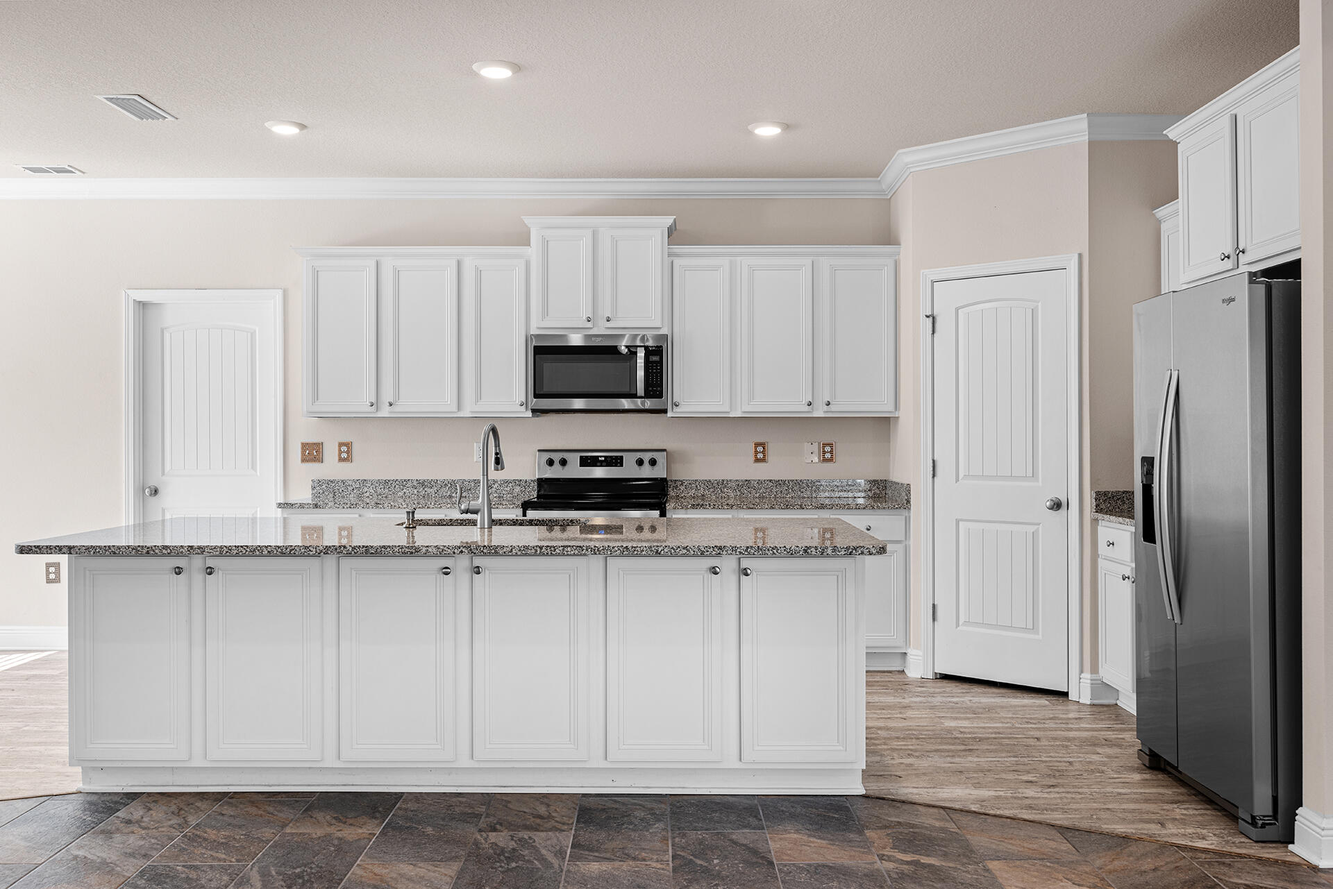 220 Conner Circle Santa Rosa Beach, FL 32459 - Photo 28 of 50 a kitchen with stainless steel appliances granite countertop white cabinets sink and a refrigerator