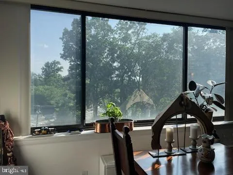 a view of a room with furniture and window