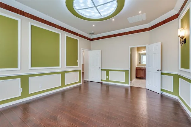 a view of an entryway with wooden floor